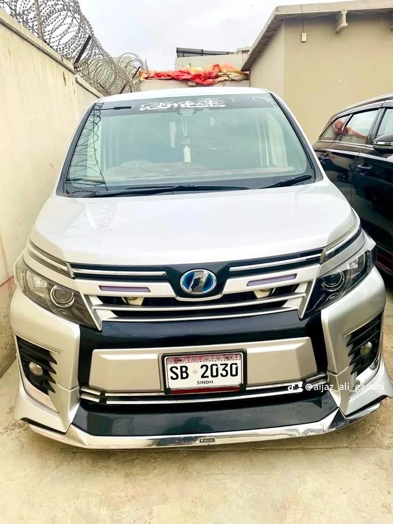 Silver Toyota Voxy hybrid, front view
